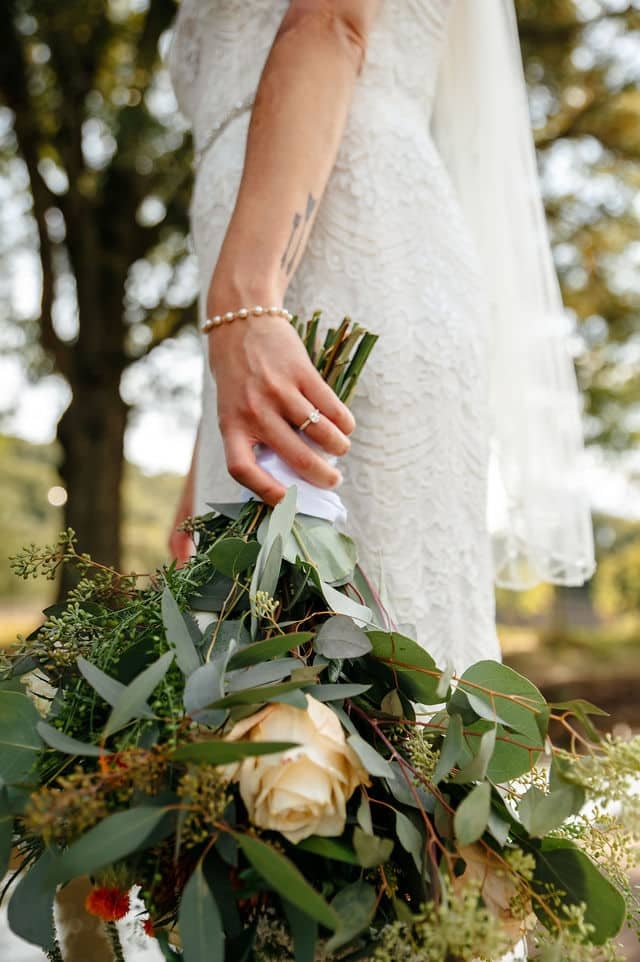 Bouquet of flower shot from the bride’s hand