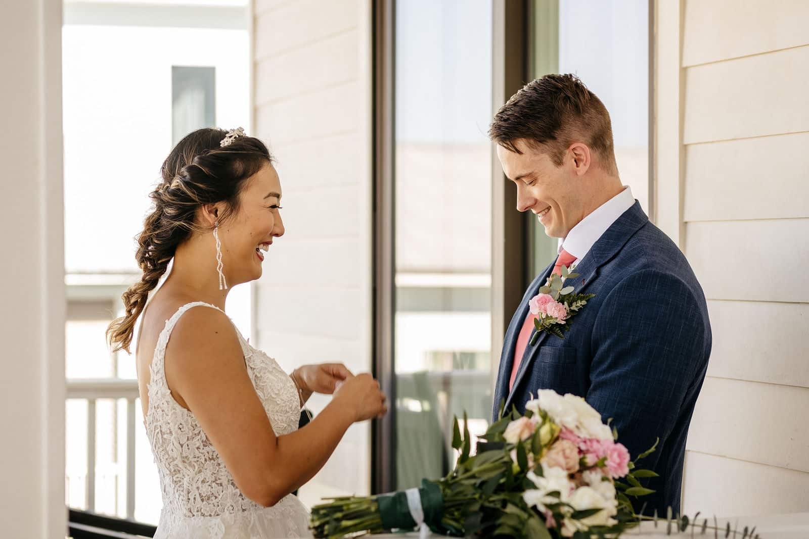 Bride and groom sharing a candid getting ready moment captured by a Georgia wedding videographer.