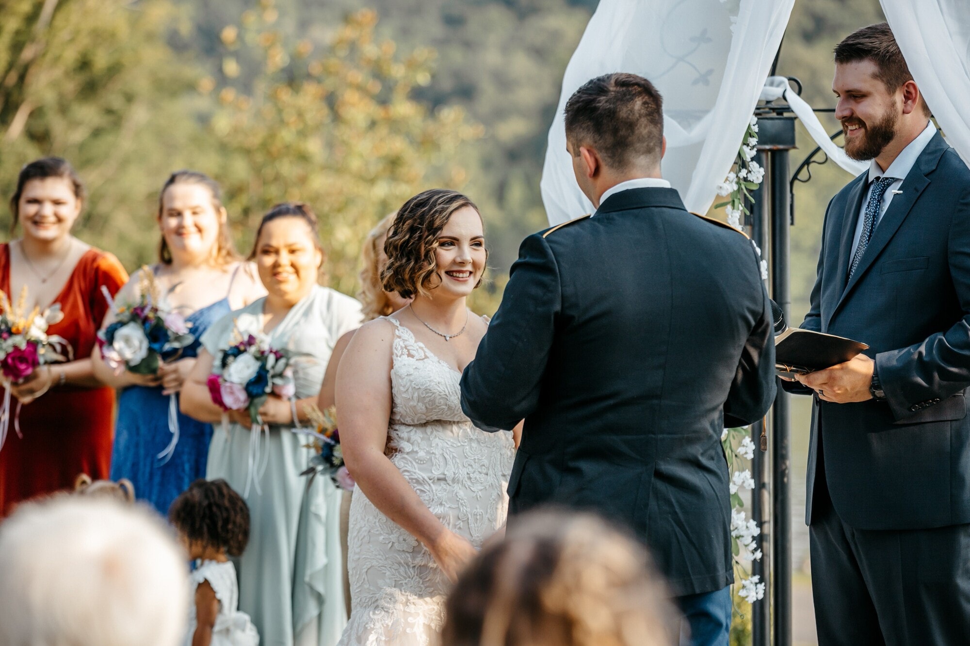 Bride smiling on her groom | The Color of Love