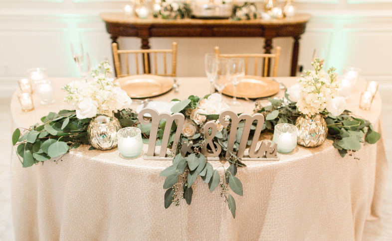 Flowers and greenery are staples of wedding tablescapes.