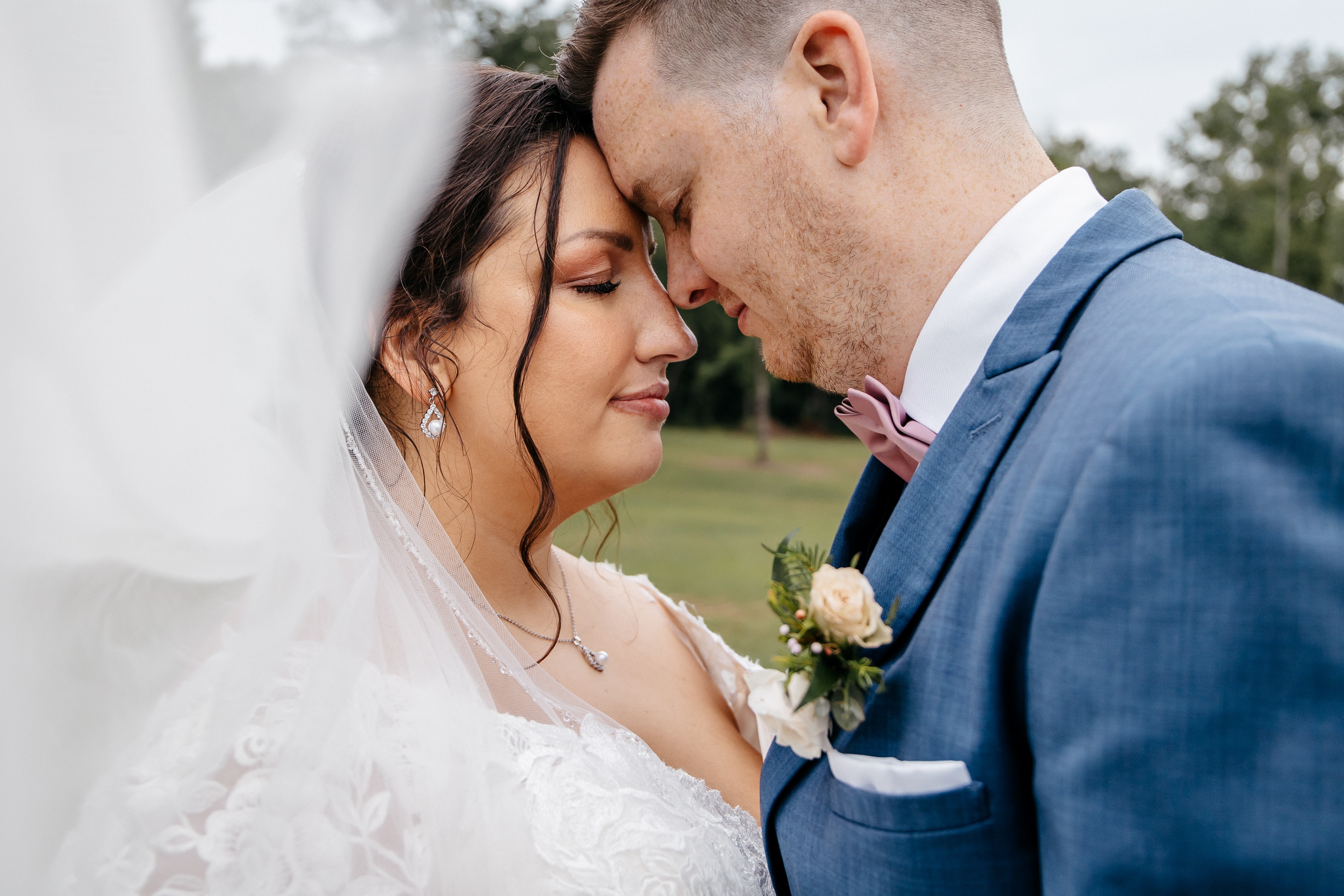 Bride and groom sharing a quiet portrait at one of the best wedding venues Georgia couples love for outdoor celebrations. 
